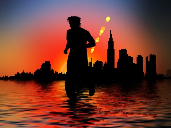 silhouette of man running in an urban scene